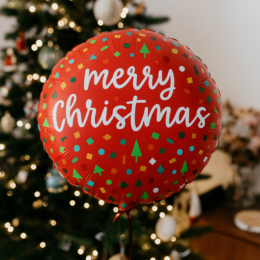Ballon Merry Christmas avec confettis colorés en gros plan