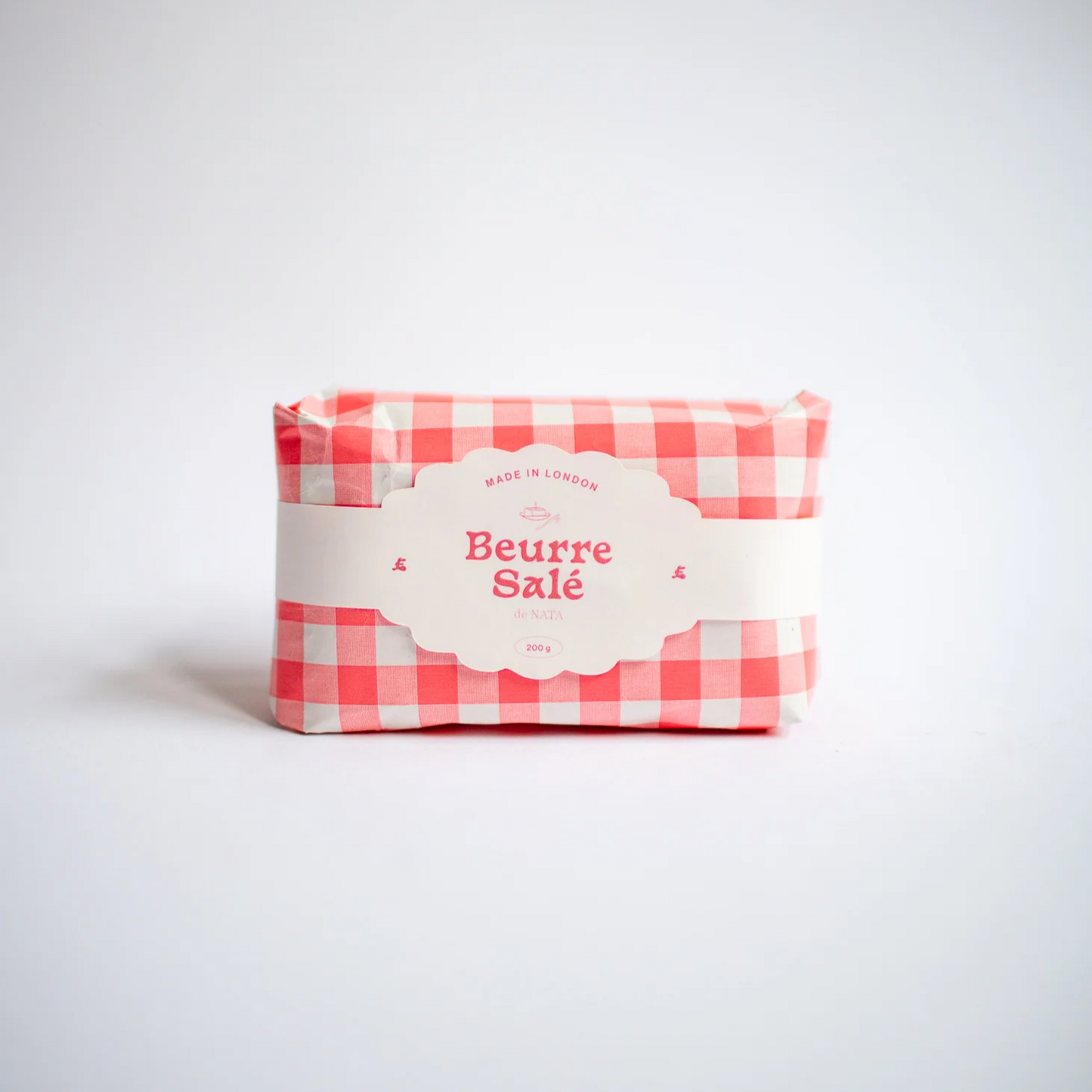 Bougie trompe l'oeil en papier vichy, aspect réaliste de beurre