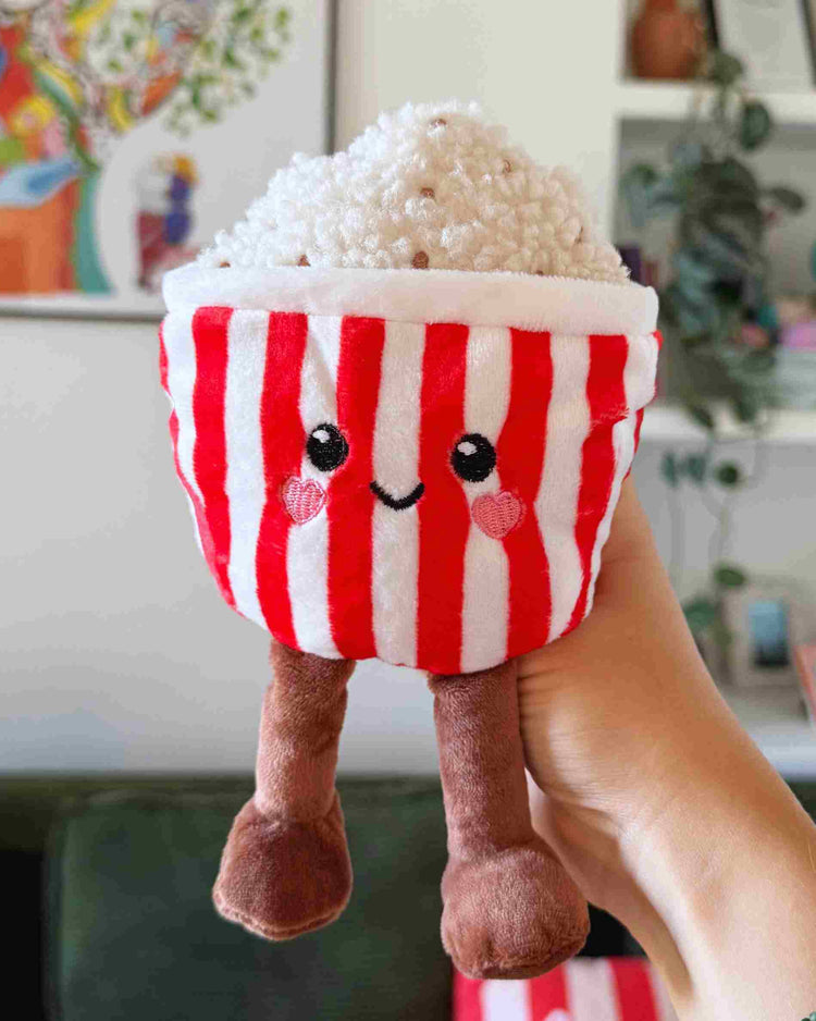 Bouillotte en forme de pot de pop-corn avec texture réaliste.