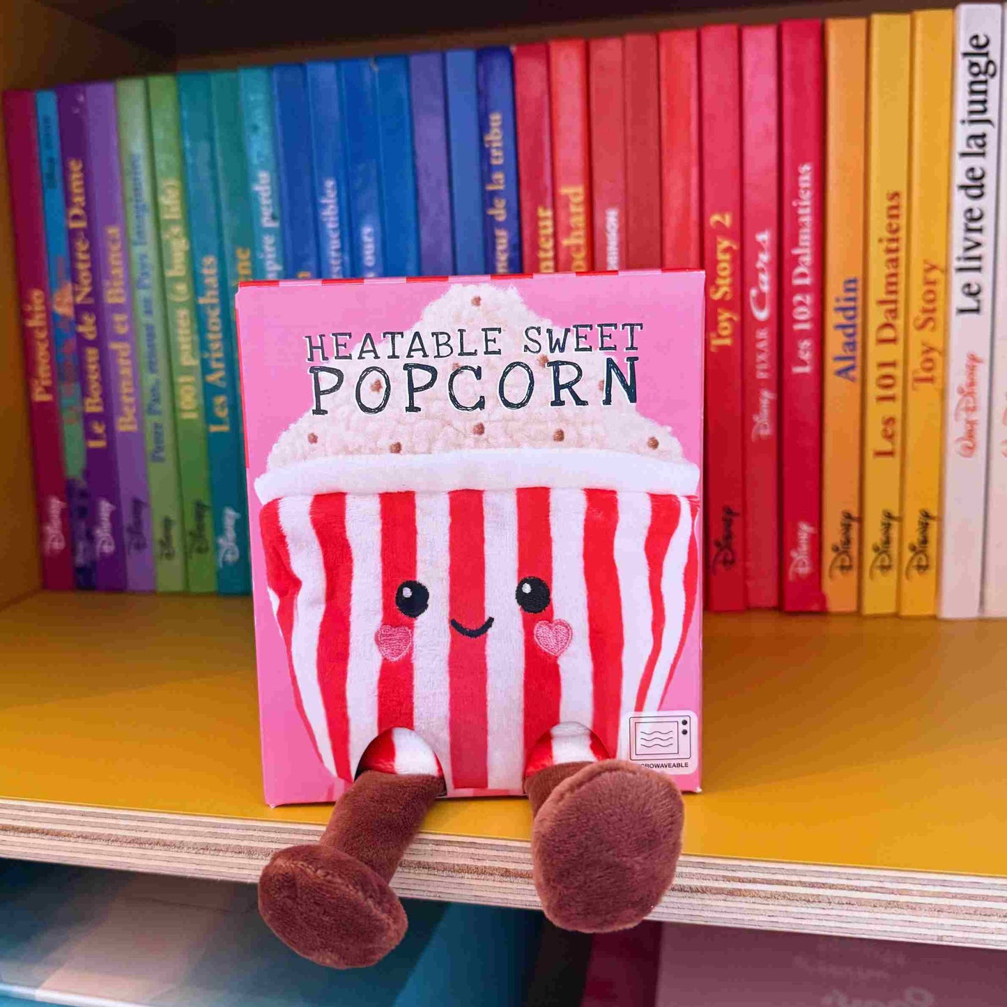 Bouillotte en forme de pot de pop-corn avec texture réaliste.