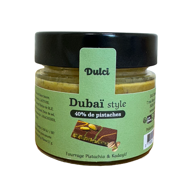 Pâte à tartiner pistache et chocolat blanc en pot en vue de dessus.