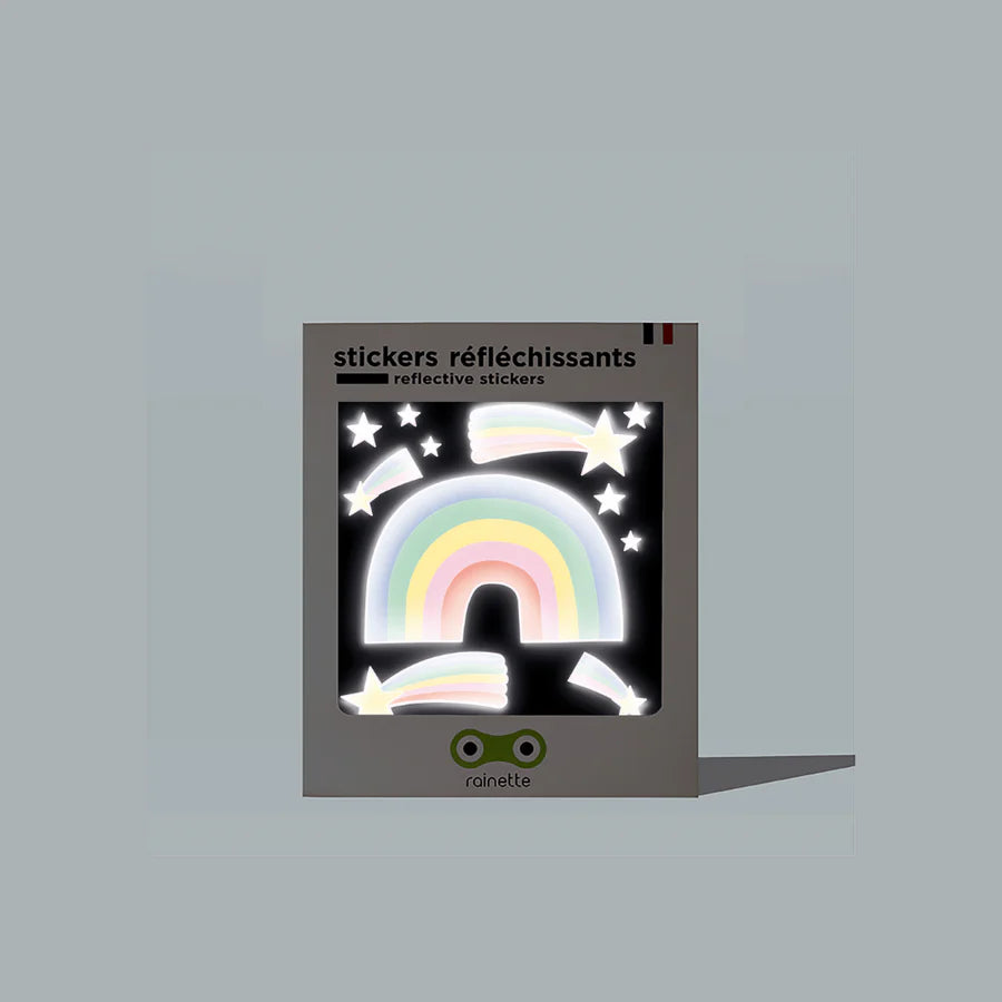 Stickers réfléchissants enfant en forme d'arc-en-ciel sur fond clair.