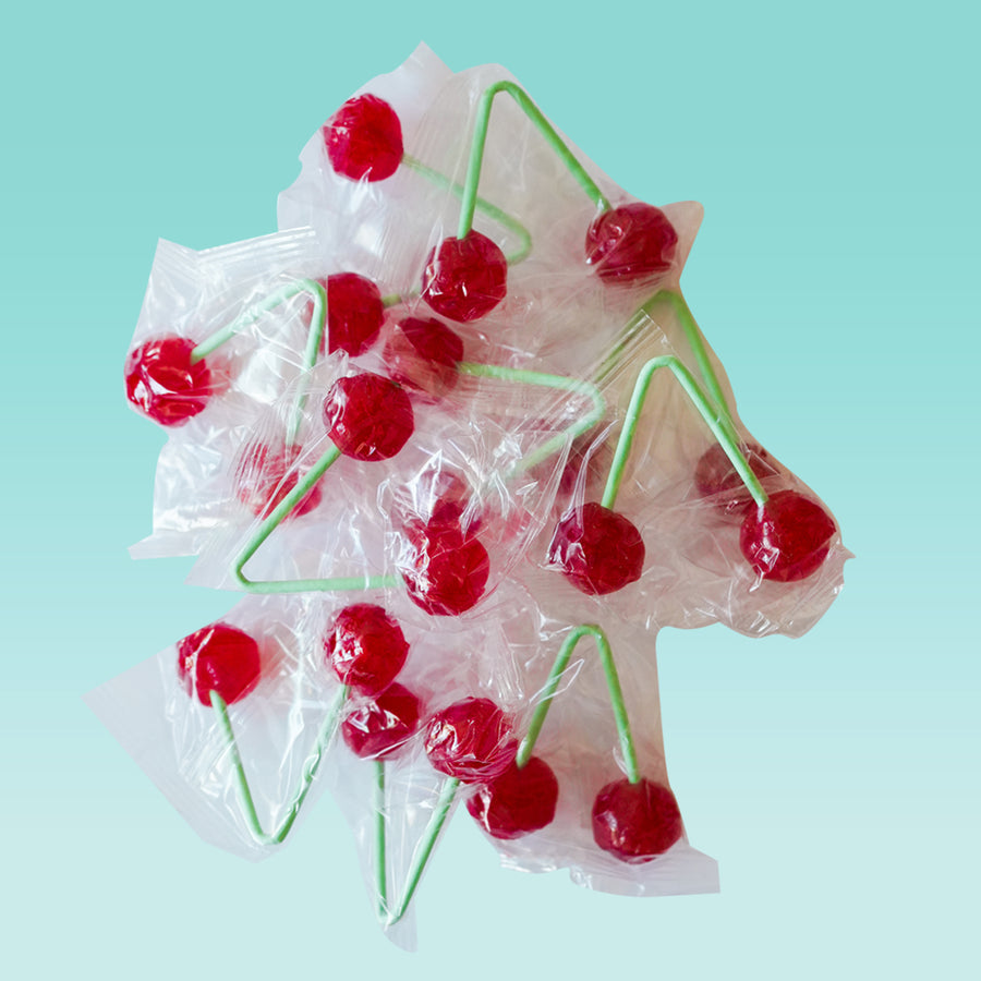 Sucette double cerise avec deux bonbons aux extrémités