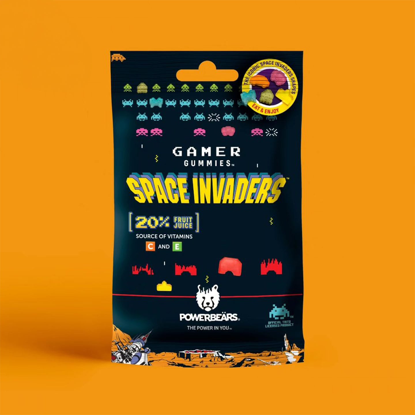 Bonbons Space Invaders en forme d'aliens colorés sur fond clair.