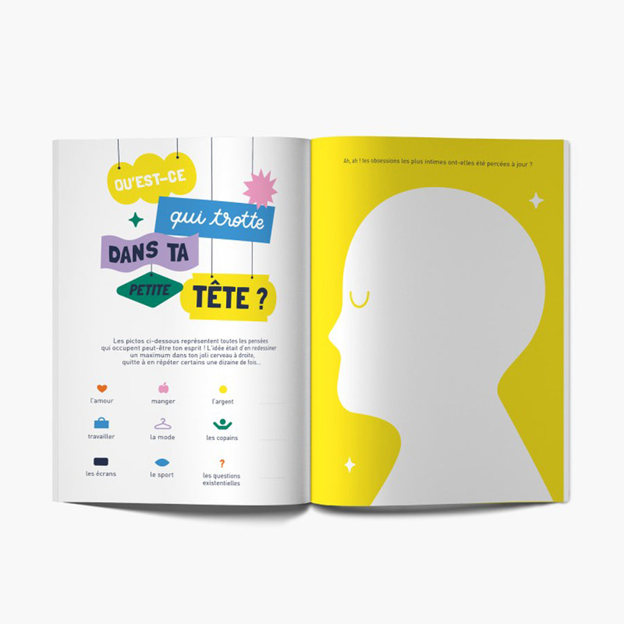 Carnet 'Vive toi !' ouvert, pages blanches avec illustrations humoristiques.