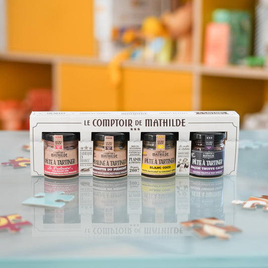 Coffret de 4 minis pâtes à tartiner avec étiquettes colorées.