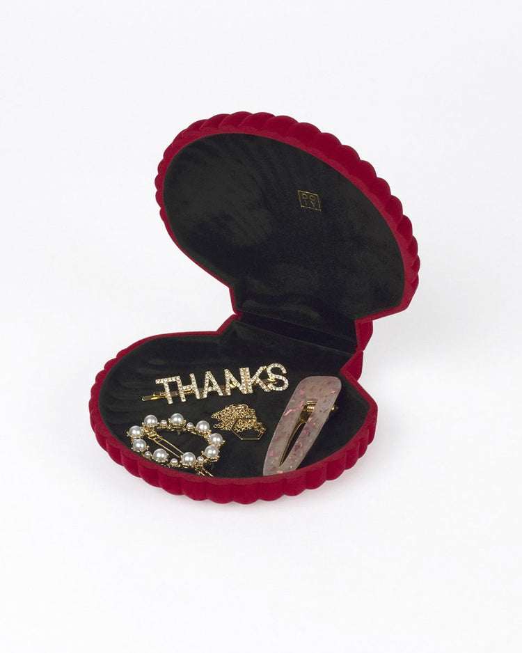 Boîte à bijoux en forme de coquillage rouge, vue de dessus