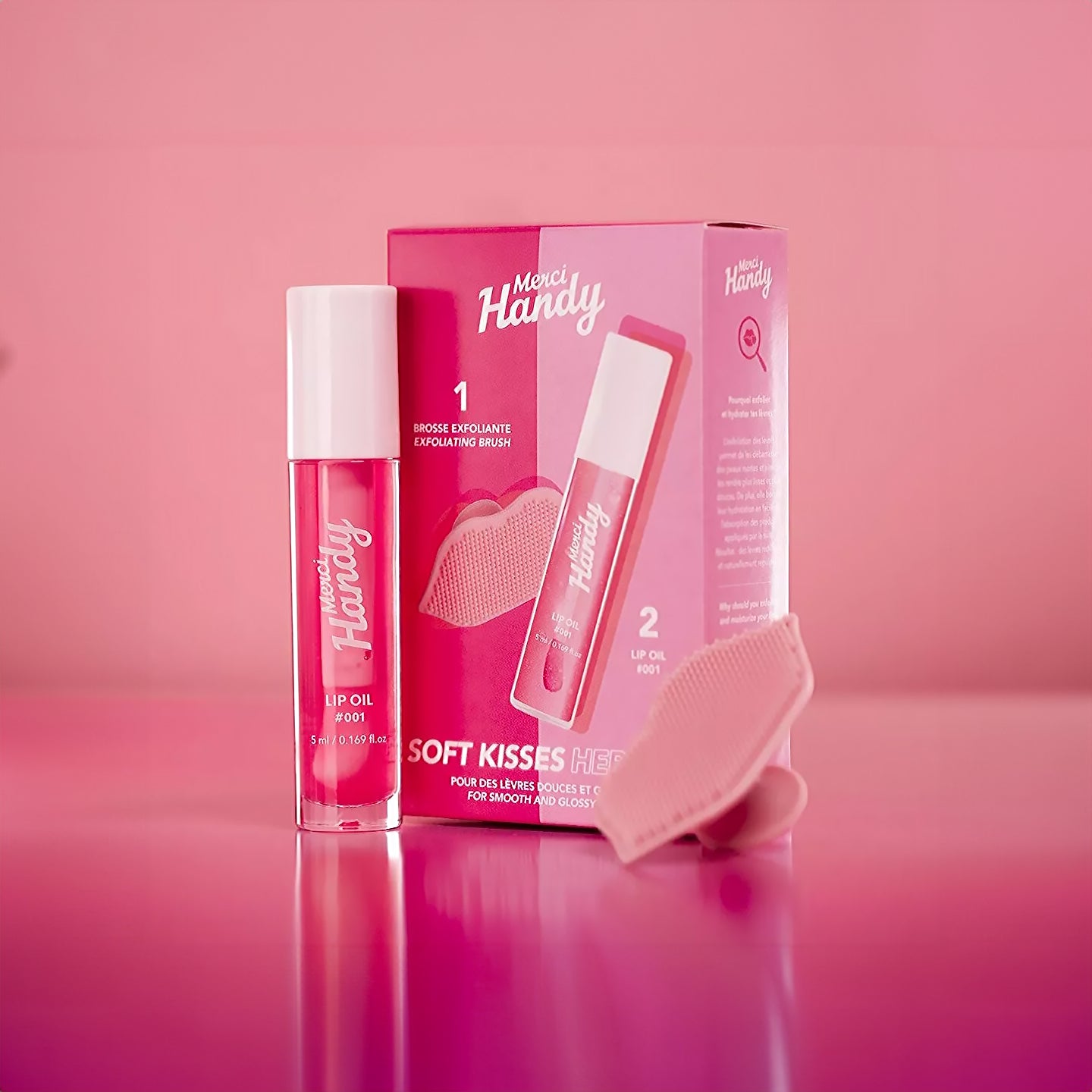 Coffret Lip Glow avec brosse exfoliante et baume à lèvres glossy.