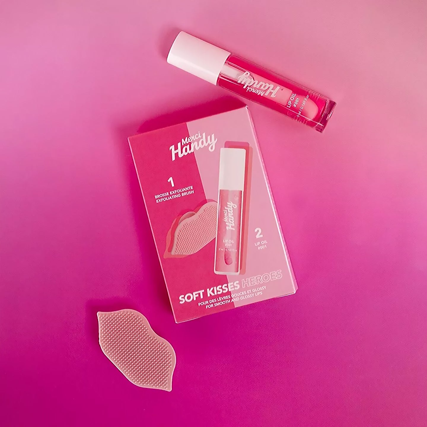 Coffret Lip Glow avec brosse exfoliante et baume à lèvres glossy.