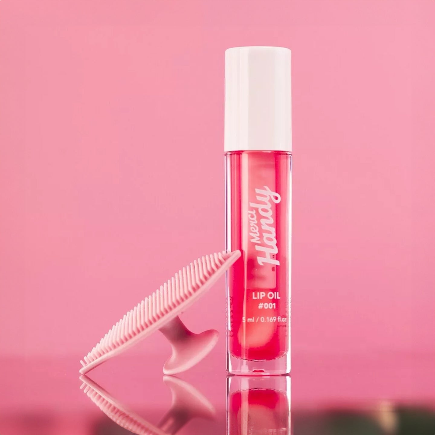 Coffret Lip Glow avec brosse exfoliante et baume à lèvres glossy.