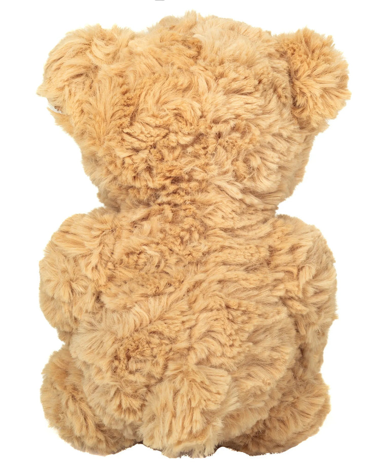 Ourson en peluche tenant un cœur rouge entre ses pattes