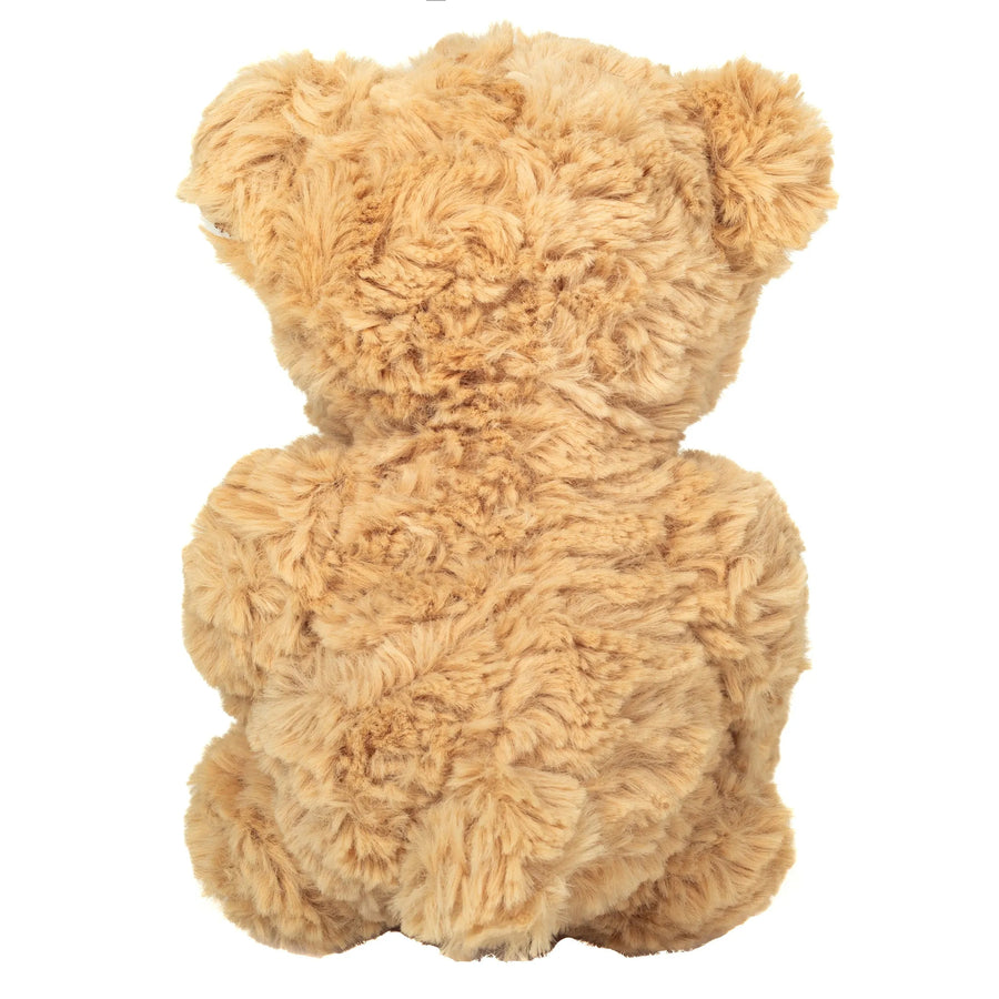 Ourson en peluche tenant un cœur rouge entre ses pattes