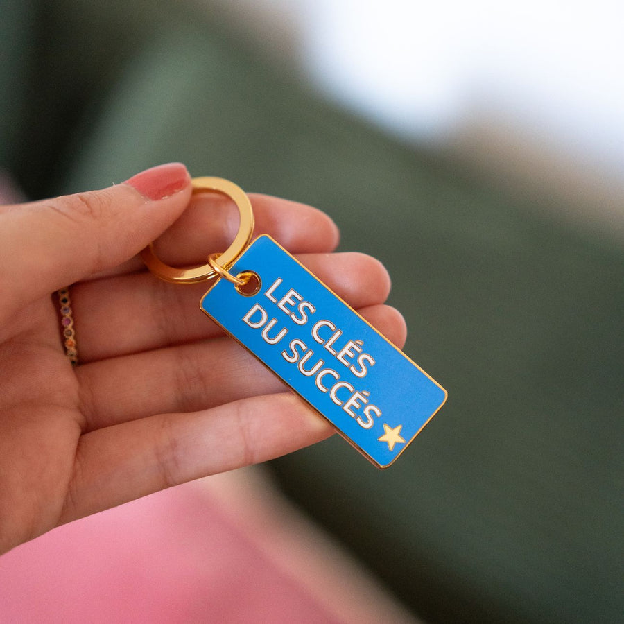 Porte-clé en métal avec inscription inspirante et finition brillante.