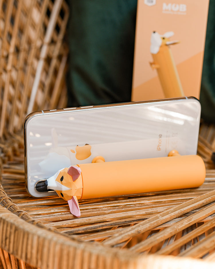 Batterie externe en forme de Corgi avec pattes ventouses.