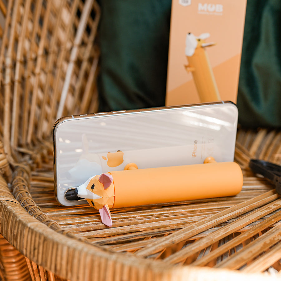 Batterie externe en forme de Corgi avec pattes ventouses.