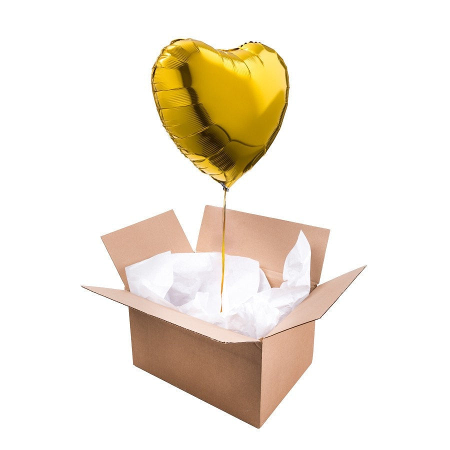 Ballon coeur doré brillant sur fond blanc