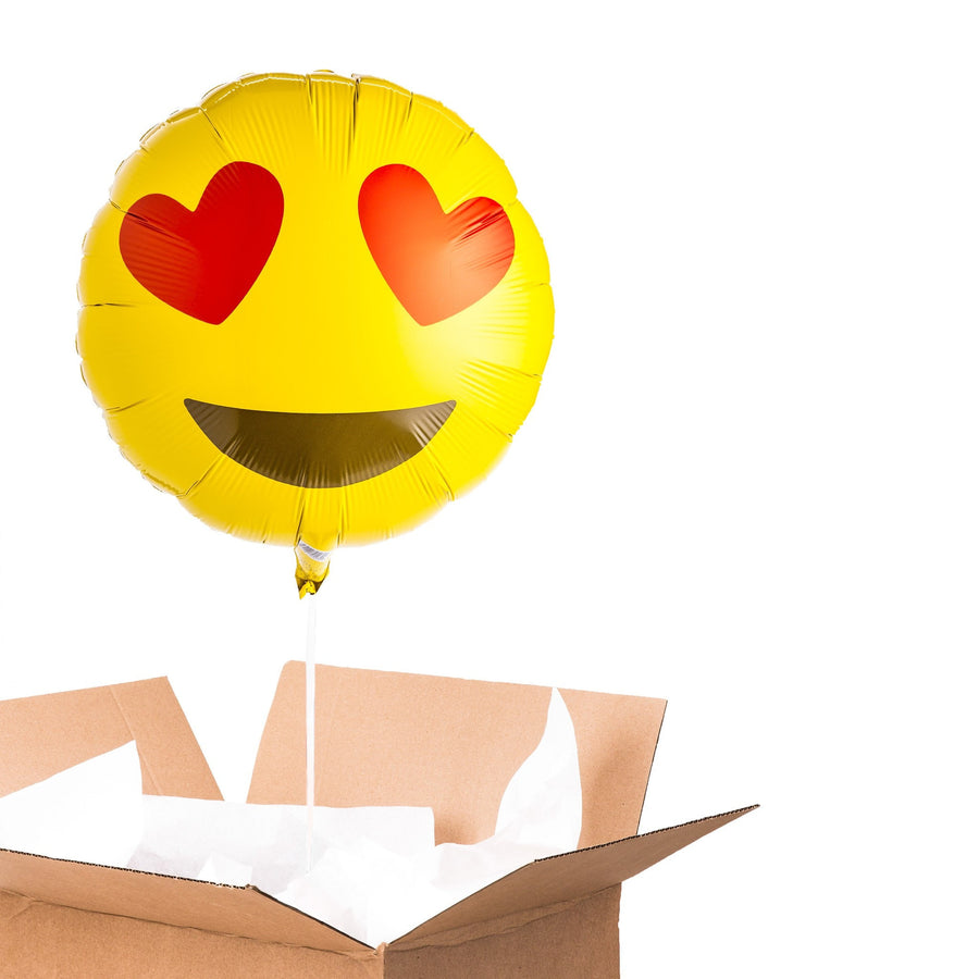 Ballon Emoji Coeurs avec motif de coeurs rouges sur fond blanc.