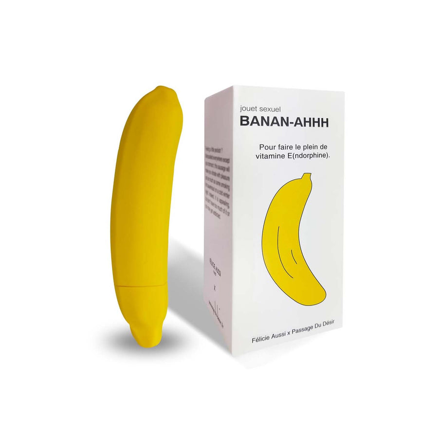 Sextoy vibrant en forme de banane, vue de côté avec texture lisse.