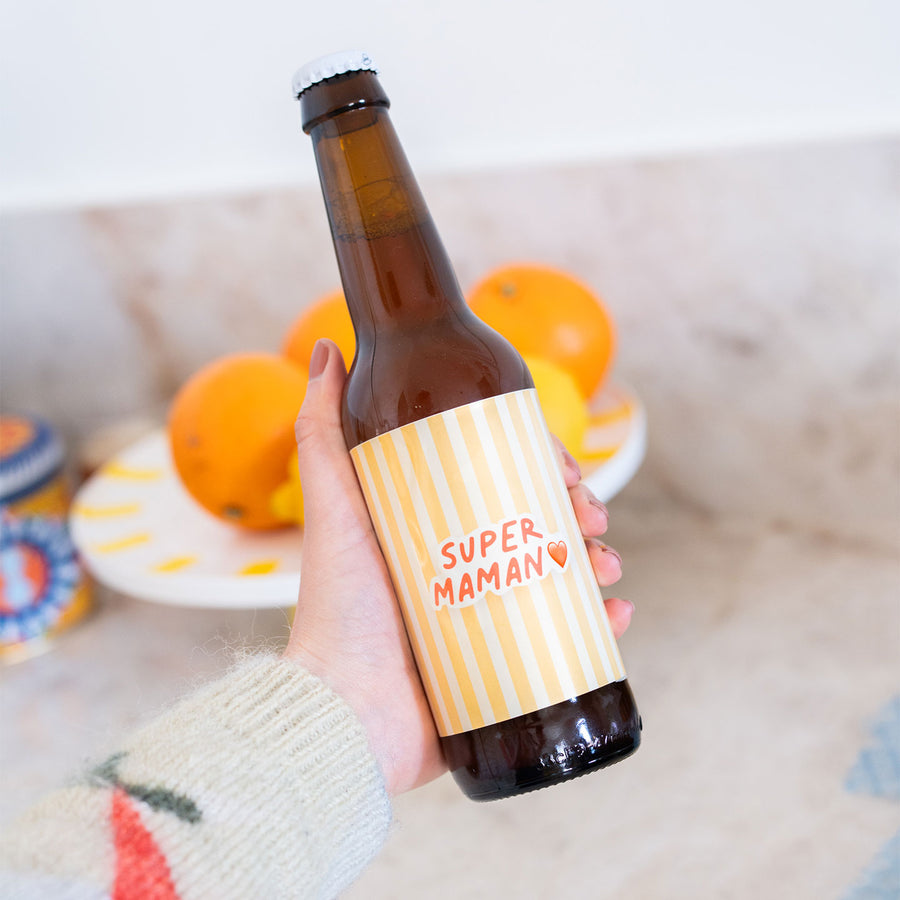 Bière Super Maman avec étiquette colorée et design festif