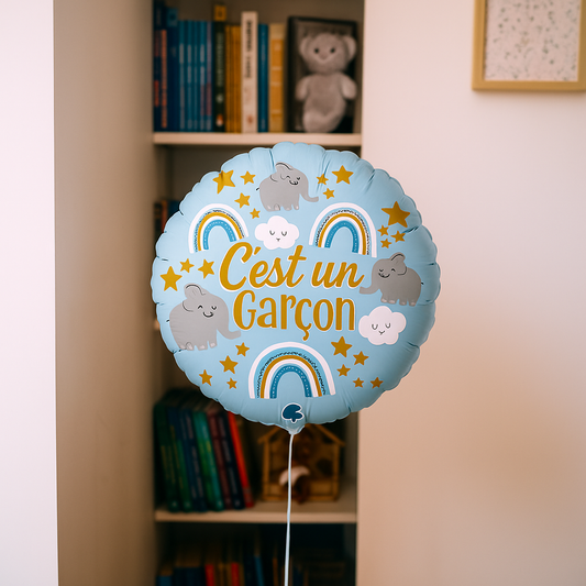 Ballon 'C'est un garçon' avec motif bleu et doré.