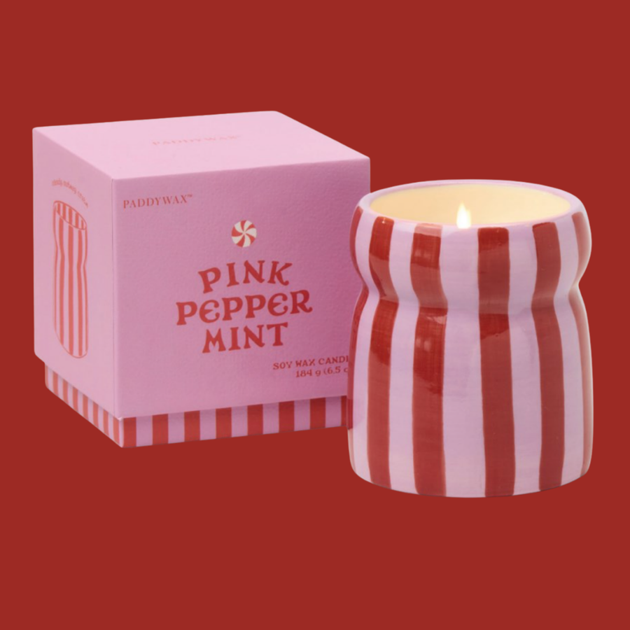 Bougie Color Pop avec pot rayé coloré et parfum sucré.