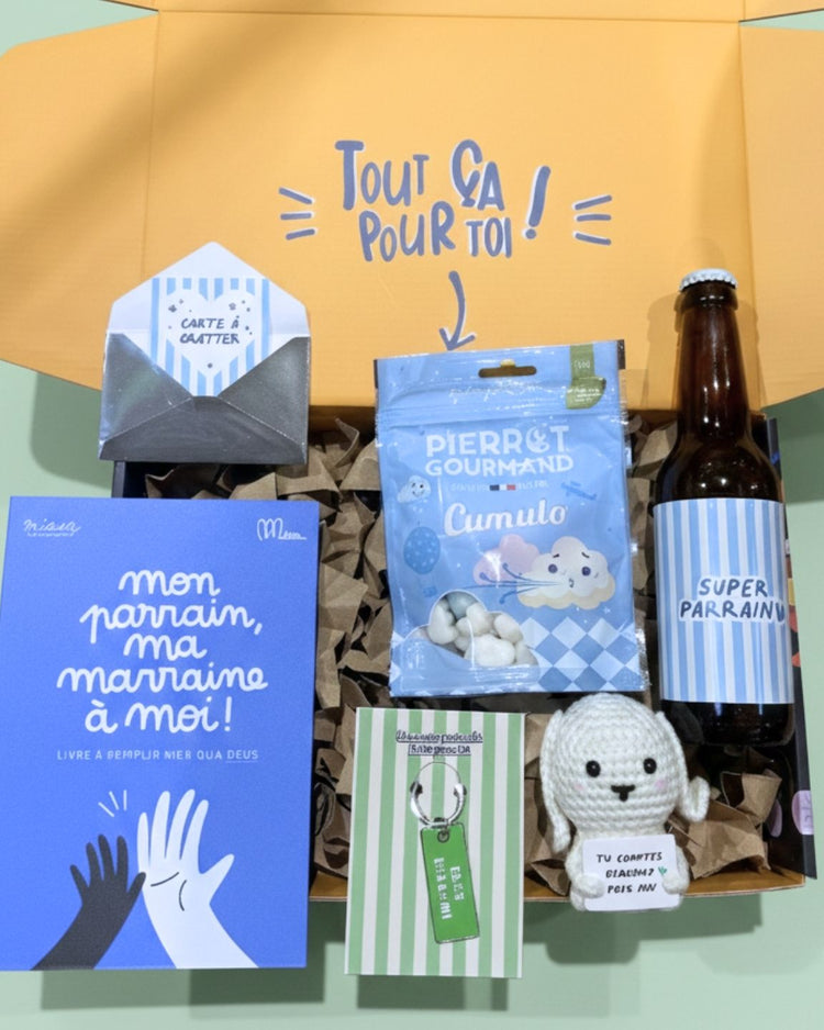 Coffret Parrain ouvert, révélant des surprises colorées à l'intérieur
