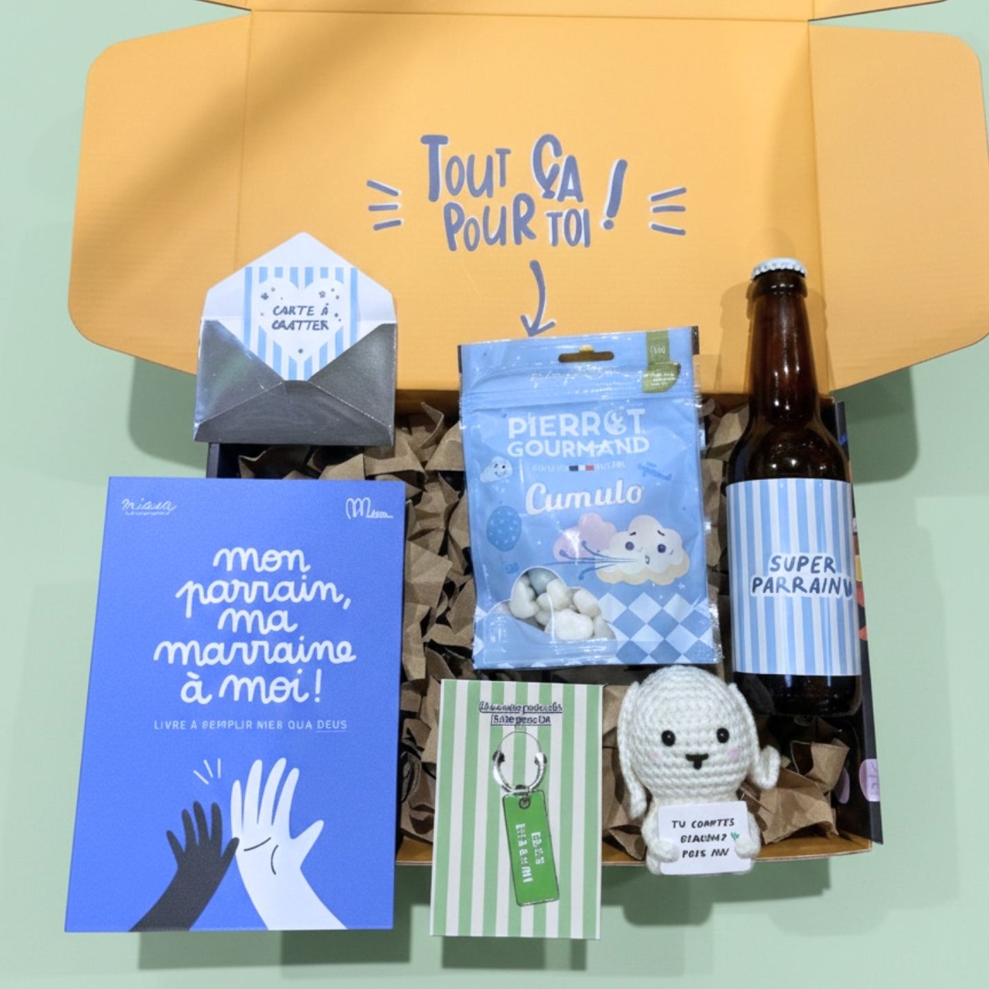 Coffret Parrain ouvert, révélant des surprises colorées à l'intérieur