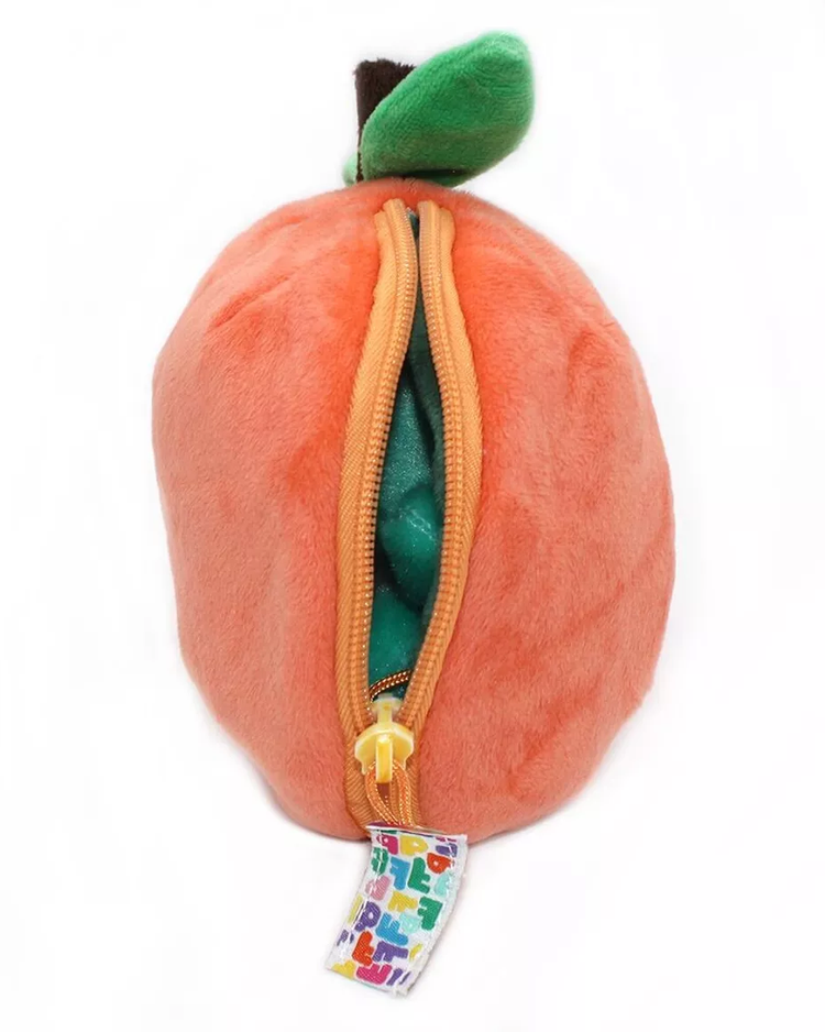 Peluche Corvet la Tortue, vue de côté avec zip ouvert.