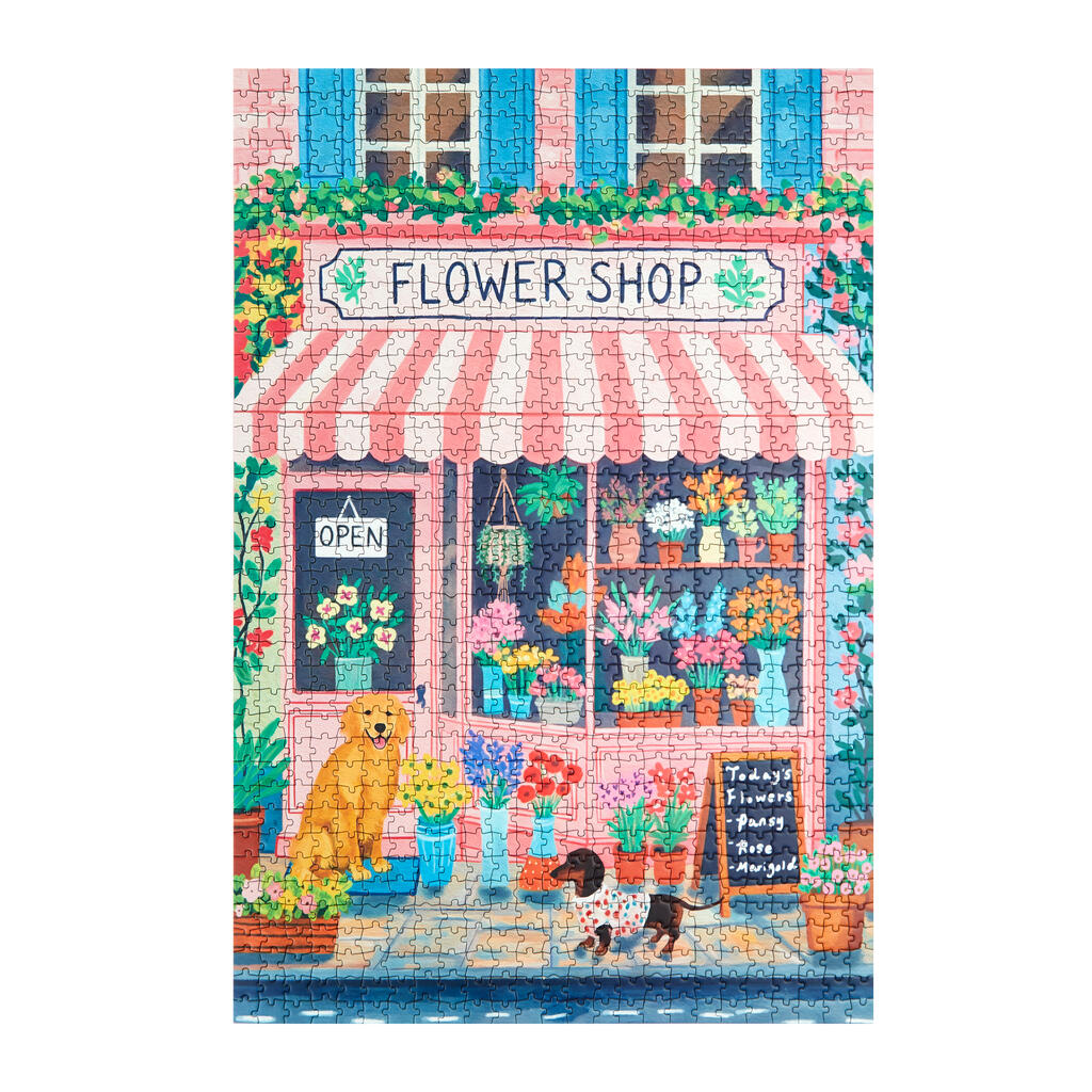 Puzzle représentant un fleuriste avec volets bleus et auvent rayé.