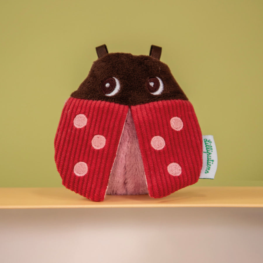 Coffret de hochets colorés avec textures variées pour bébé.