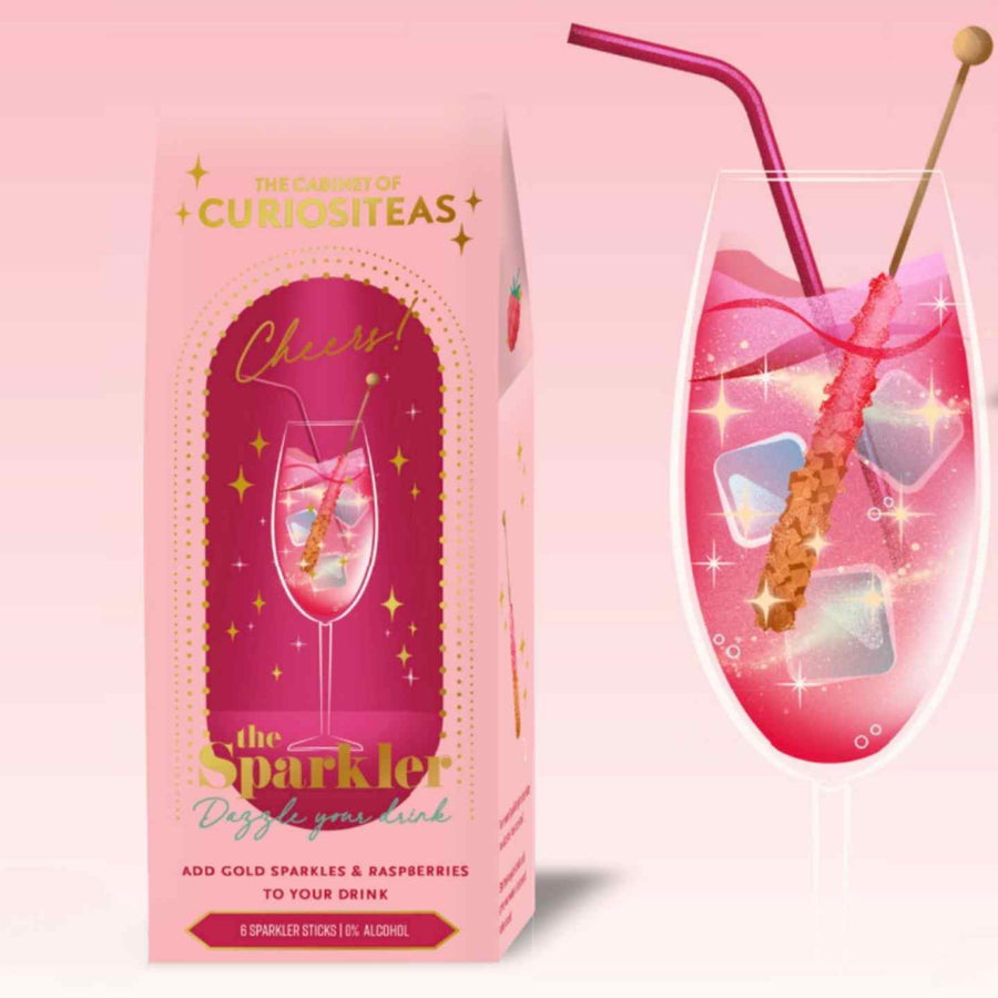 Sticks paillettes dorées avec framboises pour cocktails