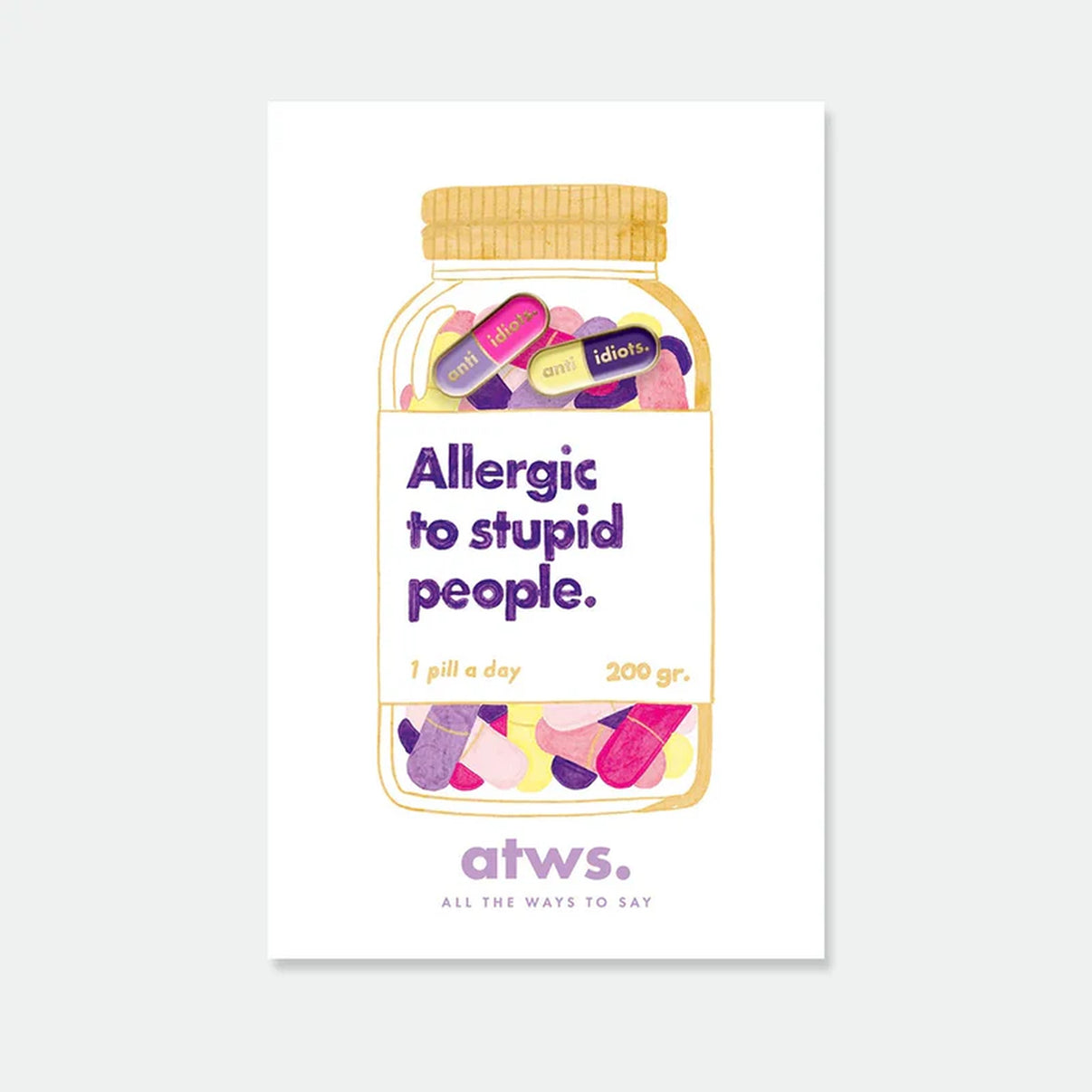 Pins en forme de capsule avec message humoristique anti-idiots