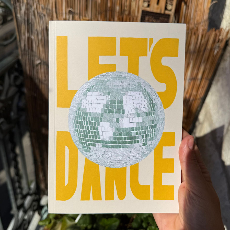 Carnet Let's Dance avec motif de boule à facettes scintillante.