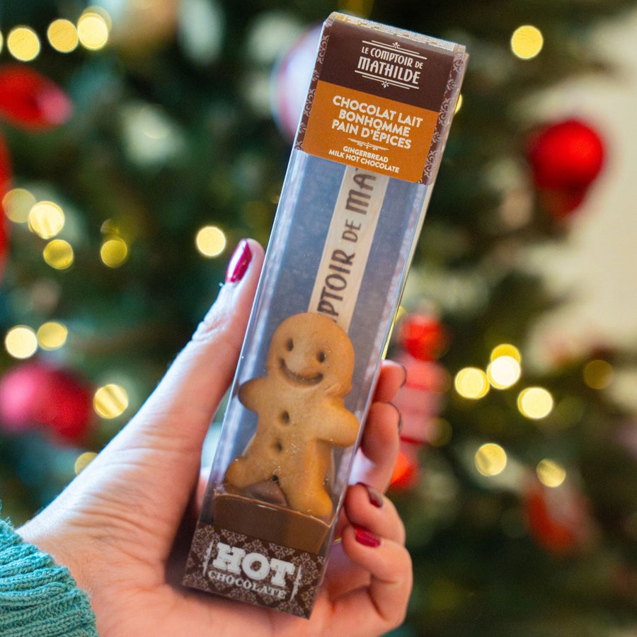 Cuillère en chocolat en forme de bonhomme de Noël sur fond clair