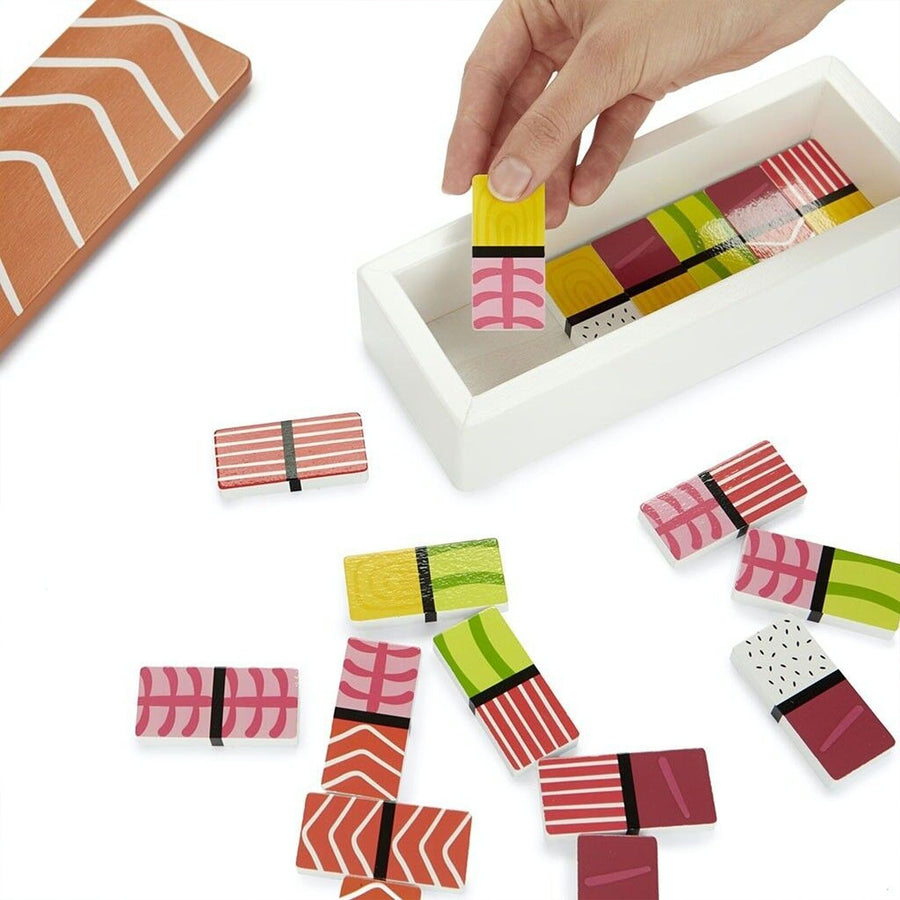 Jeu de dominos colorés en forme de sushis sur fond clair.