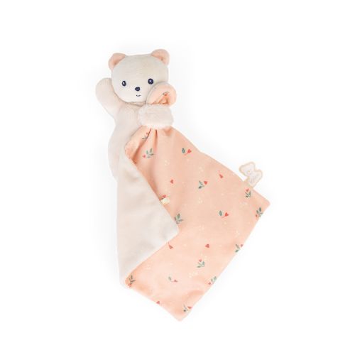 Doudou ourson avec motifs de feuilles sur le ventre.