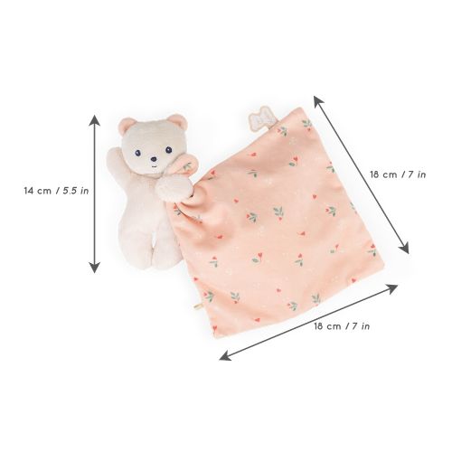 Doudou ourson avec motifs de feuilles sur le ventre.
