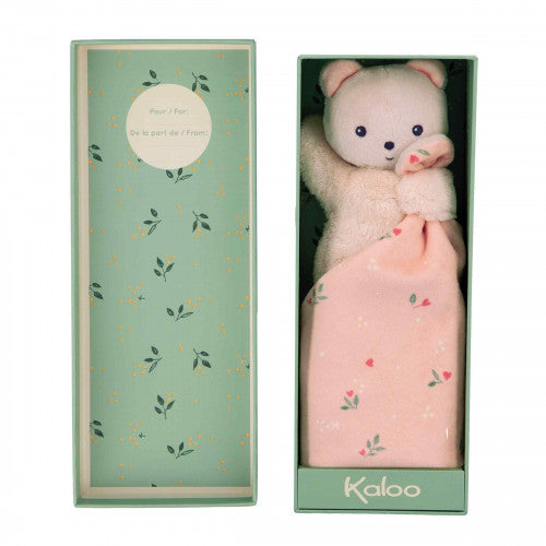 Doudou ourson avec motifs de feuilles, texture douce et apaisante.