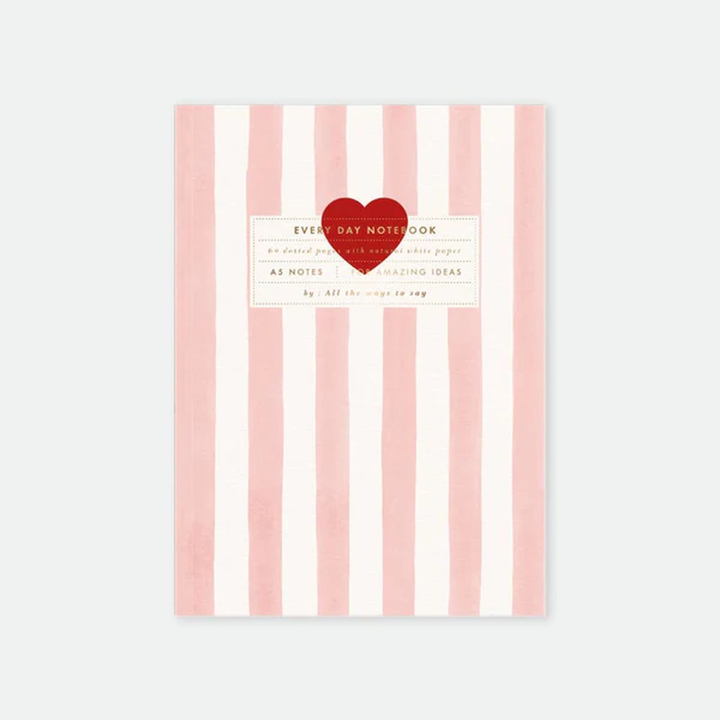 Carnet rayé rose avec cœur rouge sur la couverture
