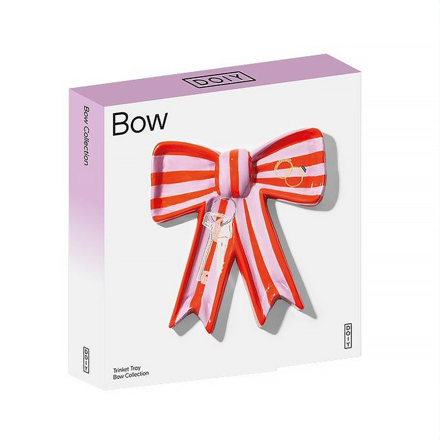 Vide poche en céramique rose avec motif nœud élégant.