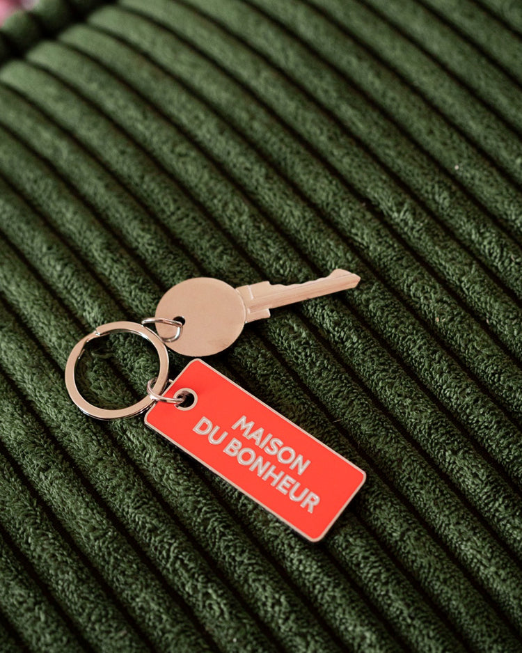 Porte-clé en forme de maison avec détails en relief