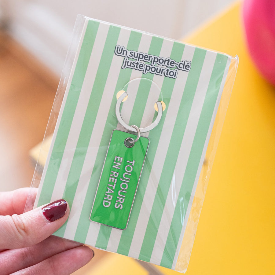 Porte-clé humoristique avec inscription sur fond clair