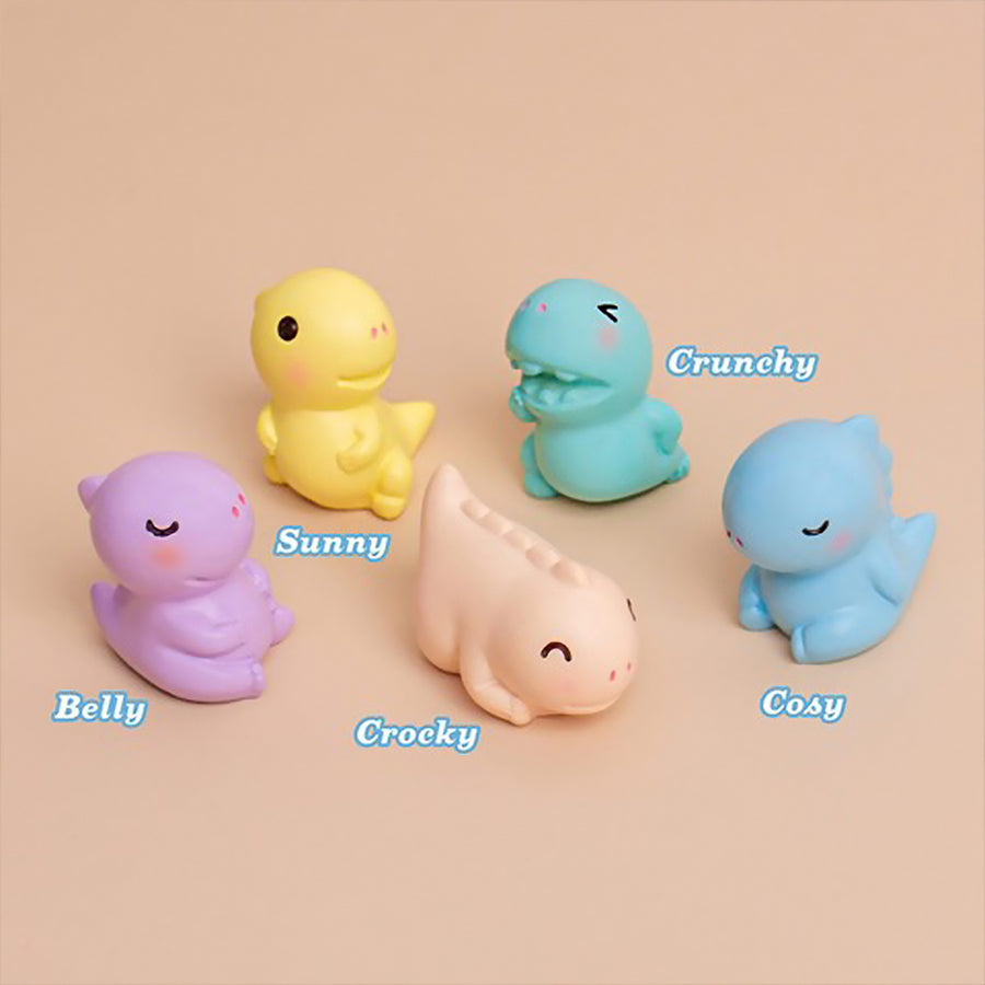 Savon bleu en forme de dinosaure avec texture amusante.