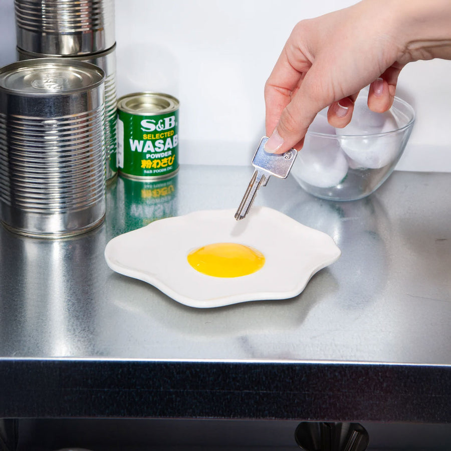 Vide poche en forme d'œuf au plat, vue de dessus
