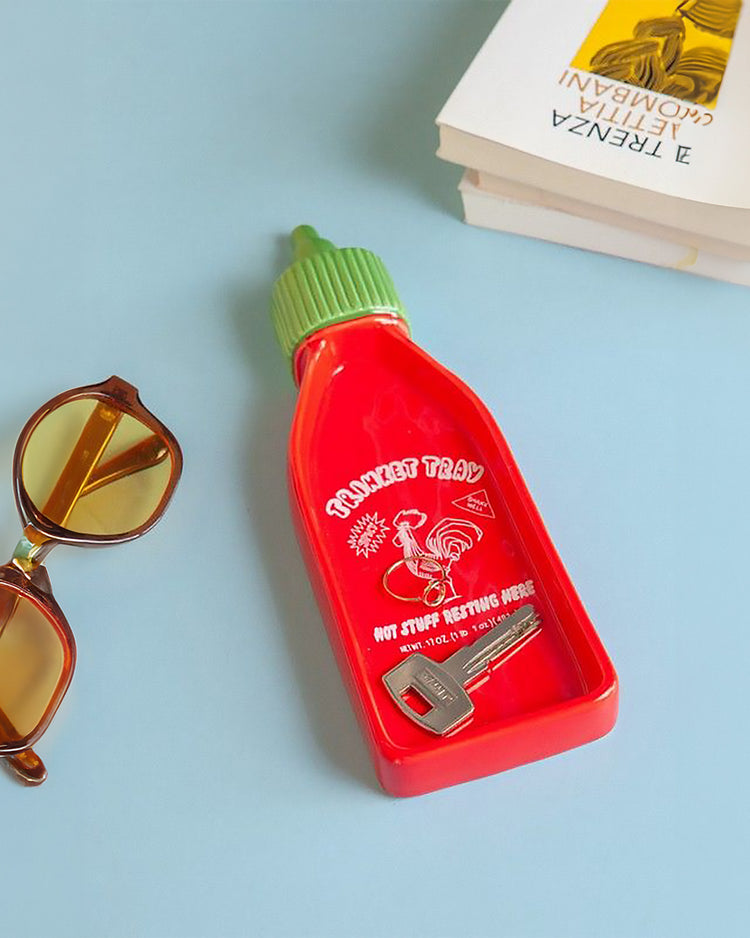 Vide-poche Sriracha avec design vibrant et texture lisse.