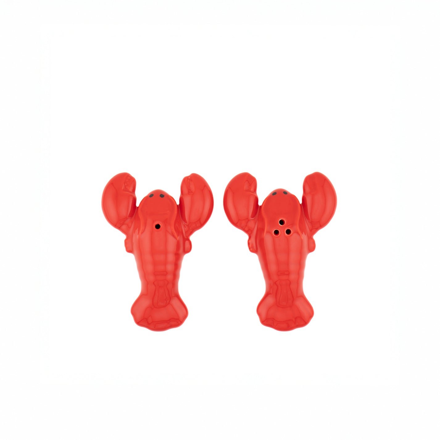 Salière et poivrière en forme de homard sur fond clair