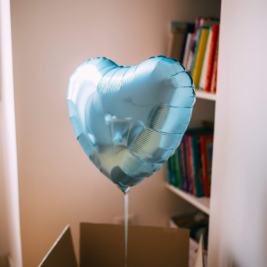 Ballon coeur bleu perle pour une décoration romantique.