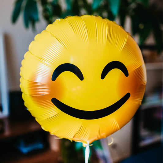 Un second ballon emoji sourire